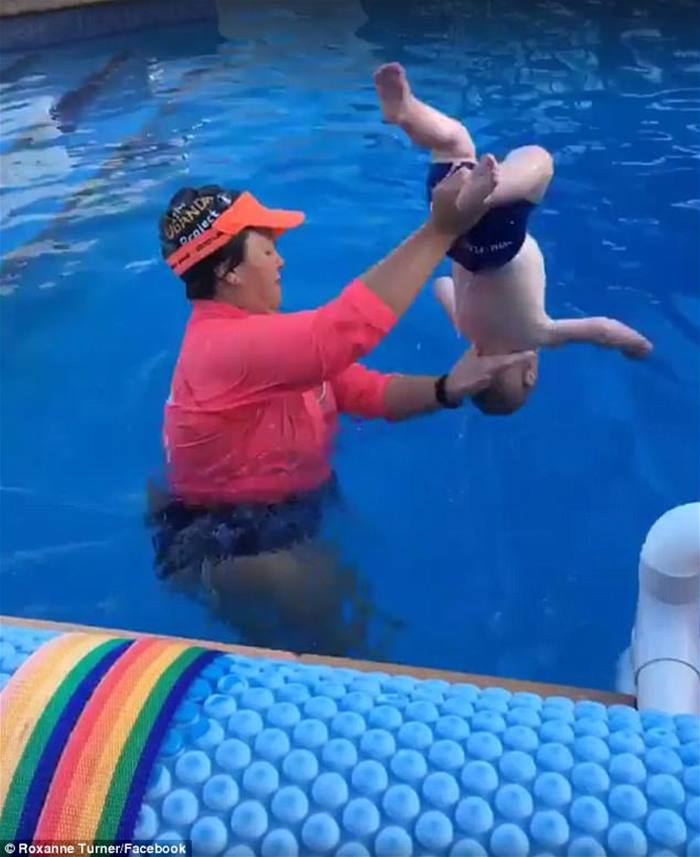 teaching baby to float in pool